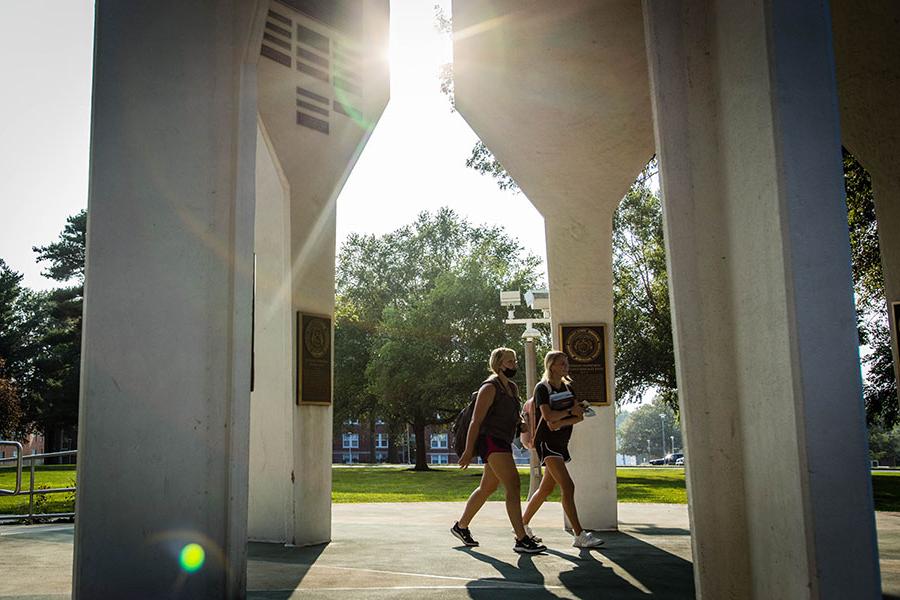 A pair of Northwest students walk under the Memorial Bell Tower on the University's Maryville campus last fall. (Photo by Todd Weddle/Northwest Missouri State University)